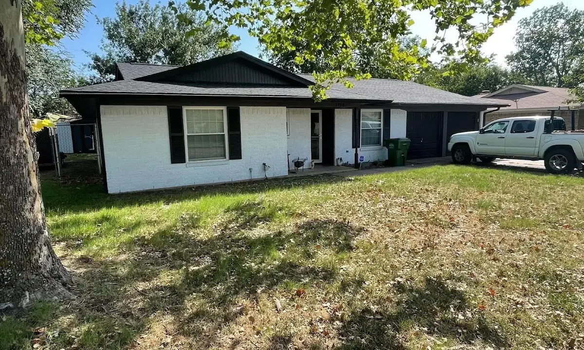 Professional roofing crew working on a residential roof in Woodridge
